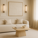 Travertine coffee table styled in modern neutral living room