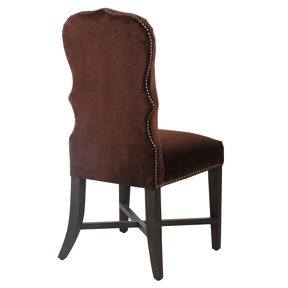 Rear view of brown velvet dining chair with curved back design
