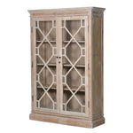 A double-fronted reclaimed pine cabinet with glazed doors and fretwork design.