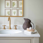 Introduce a warm, earthy touch to your home with this rustic brown metal jug, perfect for adding vintage charm to farmhouse, cottagecore, or traditional interiors. With its hand-forged look and rich brown finish, this decorative metal pitcher offers a natural, timeless appeal.
Perfectly suited as a bathroom countertop accent, it also works beautifully as a vase for dried florals, a kitchen shelf display piece, or a standalone rustic decor element. Its durable metal build and gracefully curved handle make i