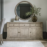 Add timeless charm and functional storage to your home with the Rustic Oakridge 3-Drawer Sideboard. Crafted from pine with a natural weathered finish, this beautifully designed sideboard showcases classic detailing and a rustic aesthetic that complements farmhouse, cottage, and traditional interiors.
Featuring three spacious drawers and three cabinet doors, the Oakridge sideboard offers ample storage for dinnerware, linens, or living room essentials. The hand-finished texture and antique brass knobs enhanc