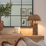 Illuminate your space with the unique charm of this rustic papier-mâché table lamp, handcrafted to bring natural texture and eco-conscious style into your home. Featuring a sculptural dome-shaped shade and a cylindrical base, this lamp showcases the organic beauty of papier-mâché craftsmanship with its earthy, weathered finish. Perfect for bohemian, minimalist, or rustic interiors, it adds a warm, ambient glow to bedroom nightstands, entryway consoles, or living room side tables.