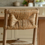 Woven chair in a kitchen setting with a neutral color palette
