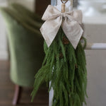 CHRISTMAS SWAG DECORATION HANGING ON DOOR