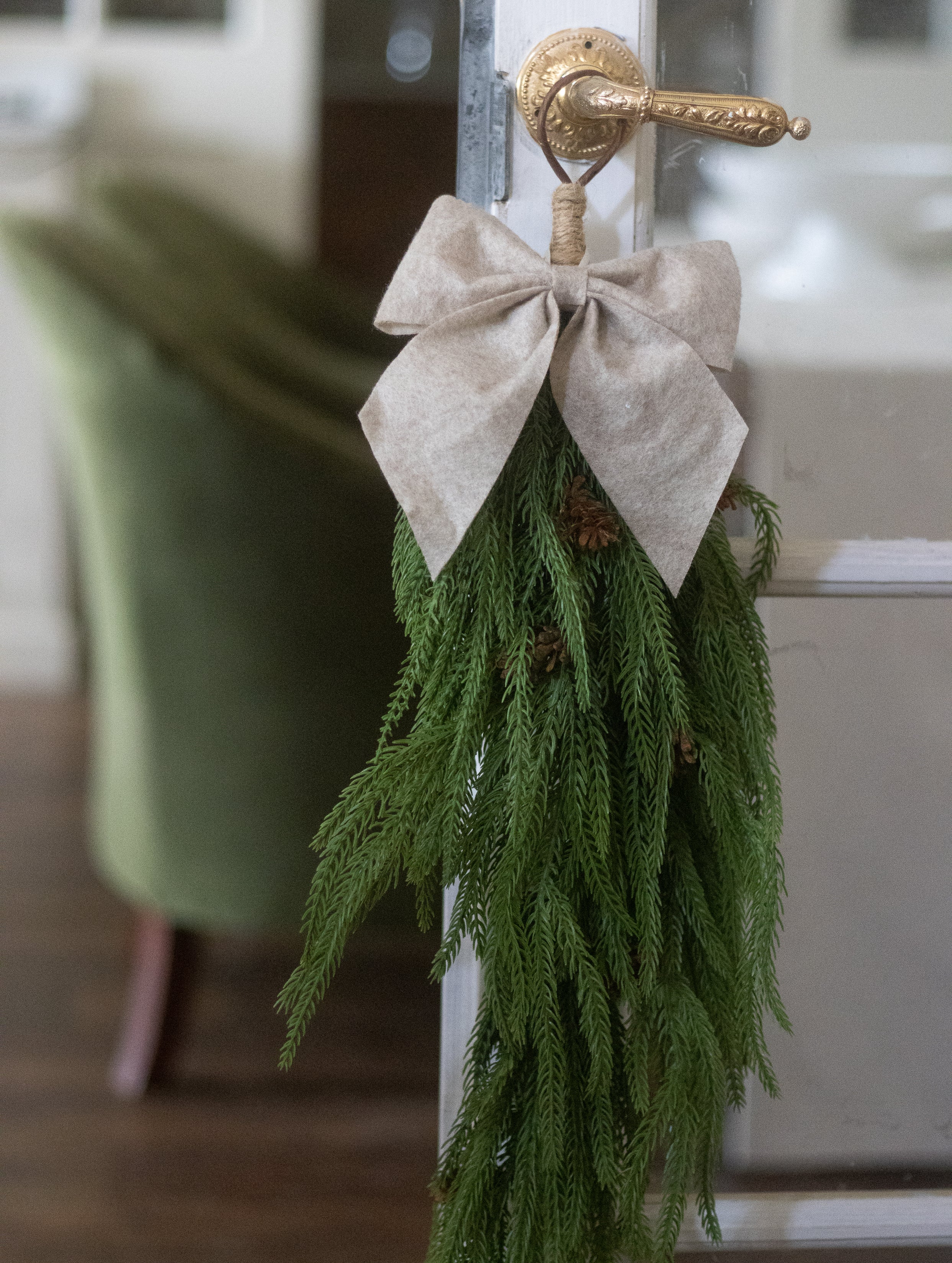 CHRISTMAS SWAG DECORATION HANGING ON DOOR