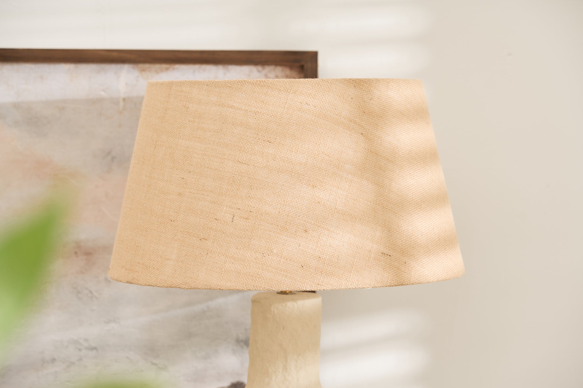 Handmade sculptural lamp with beige shade and neutral decor