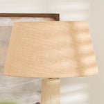 Handmade sculptural lamp with beige shade and neutral decor