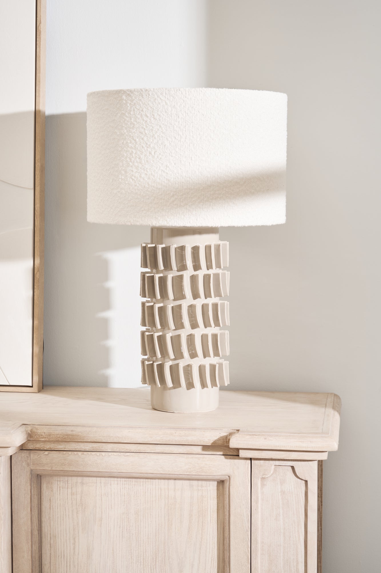 Close-up of Samsara Bouclé Table Lamp with sculptural ceramic base and textured shade