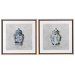 Two framed prints featuring artistic interpretations of chinoiserie pots, with predominantly white and blue colors and detailed floral and figurine designs.