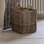 Small kubu square basket with rope handles on wooden floor