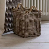 Small kubu square basket with rope handles on wooden floor