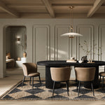 Add a touch of modern sophistication to your dining area with the Lorna Dining Chair. The black metal legs, angular yet graceful, provide a sturdy foundation while seamlessly complementing any interior aesthetic. The subtle curve of the backrest adds a touch of fluidity. Elevate your dining space with this modern masterpiece, where style meets comfort in perfect harmony.