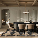 Add a touch of modern sophistication to your dining area with the Lorna Dining Chair. The black metal legs, angular yet graceful, provide a sturdy foundation while seamlessly complementing any interior aesthetic. The subtle curve of the backrest adds a touch of fluidity. Elevate your dining space with this modern masterpiece, where style meets comfort in perfect harmony.