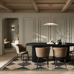 Add a touch of modern sophistication to your dining area with the Lorna Dining Chair. The black metal legs, angular yet graceful, provide a sturdy foundation while seamlessly complementing any interior aesthetic. The subtle curve of the backrest adds a touch of fluidity. Elevate your dining space with this modern masterpiece, where style meets comfort in perfect harmony.