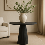 Elevate your interior with the Salisbury Ribbed Occasional Table, a timeless piece crafted from blackened oak and oak veneer. This sculptural table features a striking fluted pedestal base and a smooth round top, combining refined craftsmanship with bold modern design. The rich blackened finish highlights the natural grain of the wood, making it a versatile addition to both contemporary and traditional spaces.
Perfect as an accent table, entryway statement piece, or living room centerpiece, the Salisb