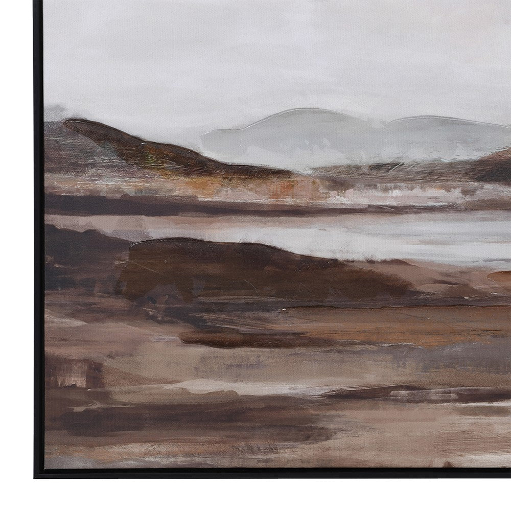 Close-up of neutral-toned landscape artwork in modern black frame