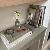 Add a touch of timeless charm to your home decor or office desk with this vintage-style magnifying glass. Featuring a polished metal frame and a classic wooden handle, this decorative piece blends functionality with elegance. Whether used for reading fine print, inspecting small objects, or simply as a stylish tabletop accessory, this antique-inspired magnifying glass is perfect for enhancing any modern farmhouse, rustic, or traditional interior.
Perfectly styled atop coffee table books like "Pacific Natur