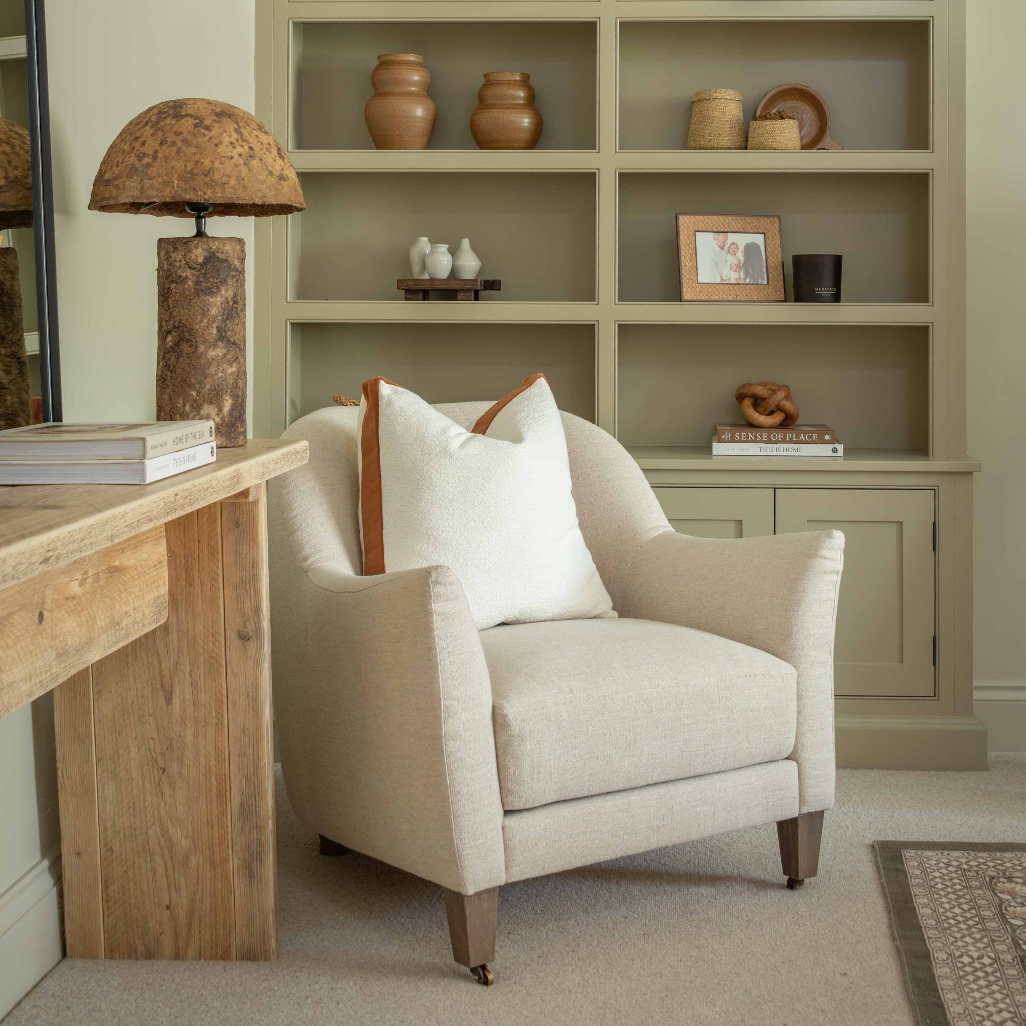 Elevate your home décor with this elegant white bouclé cushion, featuring a refined 4cm contrasting velvet band for a touch of timeless sophistication. Crafted with a textured bouclé fabric, this cushion adds depth and softness to any setting. The luxury feather inner offers superior comfort and a plush feel, making it both a stylish and cozy addition to your living room, bedroom, or reading nook. Perfect for neutral, minimalist, or modern interiors, this decorative cushion blends seamlessly into any space