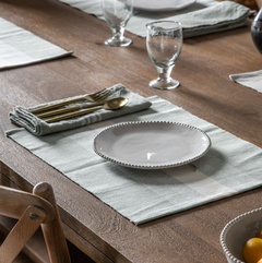 White ceramic side plate with subtle rim detailing