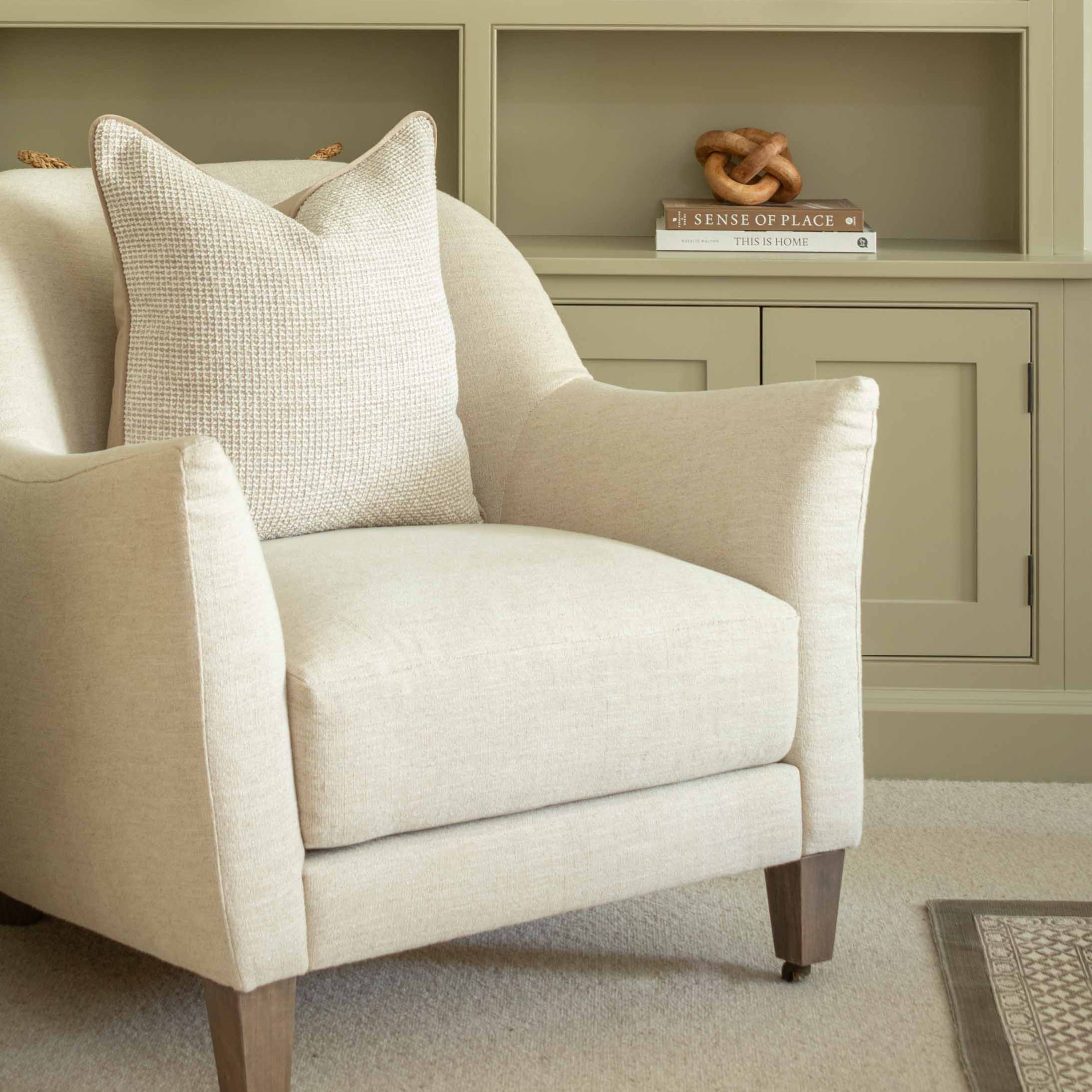 Elevate your space with the timeless elegance of the Willow cushion. Featuring a sophisticated tweed-style fabric in a soft, stone-like hue, this neutral accent pillow brings texture and warmth to any interior. The cushion is backed and piped with a smooth beige velvet, offering a luxurious contrast and refined finish. Perfect for modern, transitional, or classic décor styles.