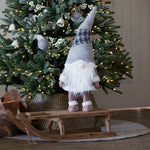 Wood sleigh, with one of Santa's elves standing on it
