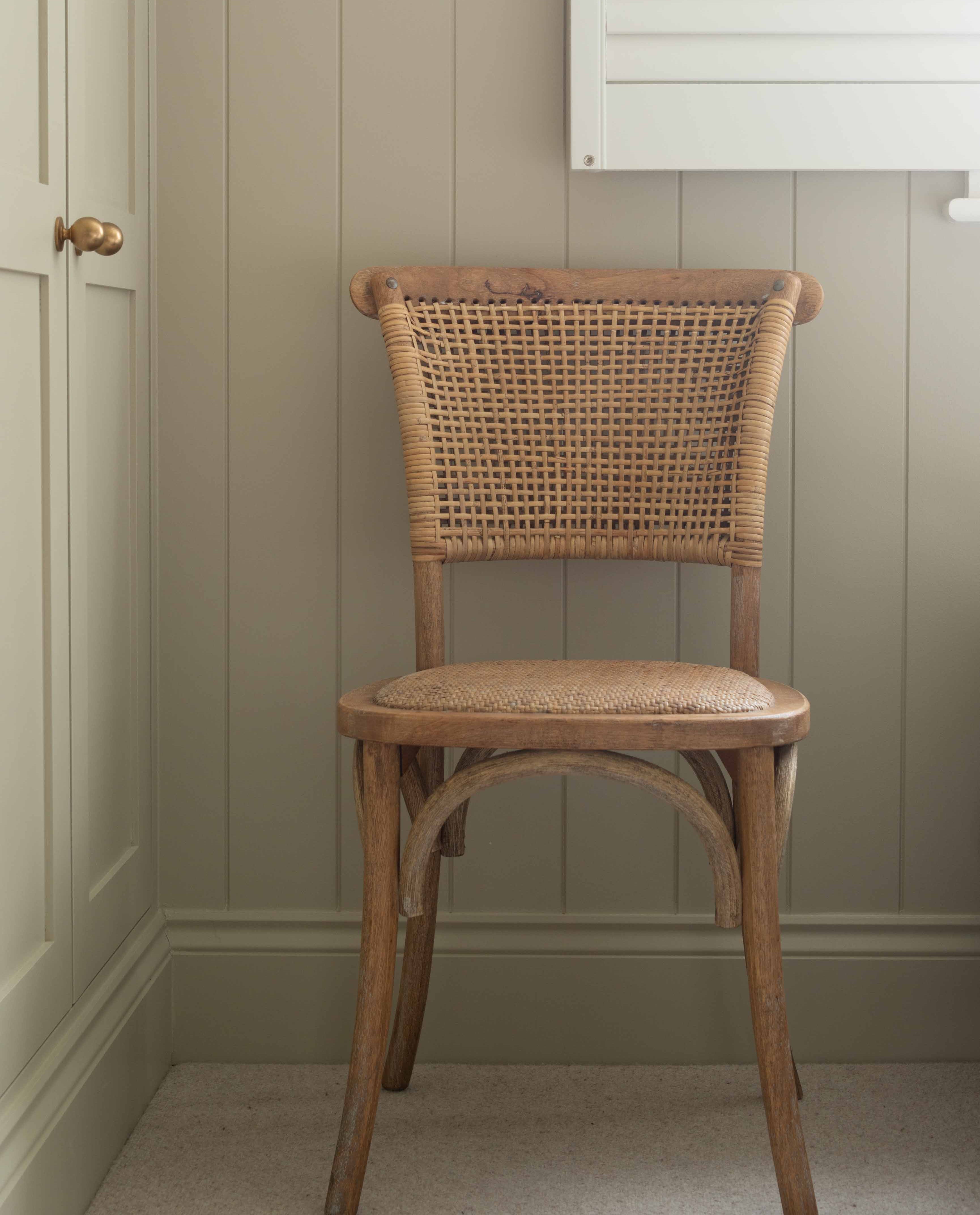 Exuding French-inspired elegance, this stunning open weave back chair is expertly crafted from premium rubber wood and rustic rattan.