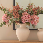 Elevate your home decor with our ceramic vase available in three sizes, perfect for creating a sophisticated and timeless aesthetic. Handcrafted with a smooth matte finish, this elegant neutral-toned vase blends effortlessly with any interior style—from modern minimalist to rustic farmhouse. Whether used as a centerpiece for fresh blooms, dried flowers, or as a standalone accent, this versatile decorative vase adds charm and dimension to consoles, mantels, and shelves.
Available in small, medium, and large