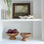 A set of three decorative faux green and purple artichokes.