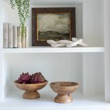 A set of three decorative faux green and purple artichokes.