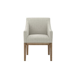 The Marisia Linen Effect Dining Chair boasts a warm wooden frame and bisque linen upholstery. Its spacious seat, built-in arms, and traditional design provide both comfort and timeless elegance in a versatile neutral tone.