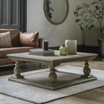 Elevate your living room with this beautifully crafted pine coffee table, designed to blend timeless rustic charm with contemporary sophistication. Featuring a solid pine wood construction and a classic pedestal base with turned legs, this statement piece adds warmth and character to any décor style—from traditional to modern farmhouse.
The spacious square tabletop offers ample room for books, candles, and decorative accents, while the sturdy lower shelf enhances stability and adds functional display space