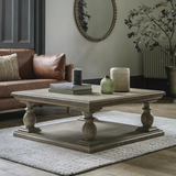 Elevate your living room with this beautifully crafted pine coffee table, designed to blend timeless rustic charm with contemporary sophistication. Featuring a solid pine wood construction and a classic pedestal base with turned legs, this statement piece adds warmth and character to any décor style—from traditional to modern farmhouse.
The spacious square tabletop offers ample room for books, candles, and decorative accents, while the sturdy lower shelf enhances stability and adds functional display space