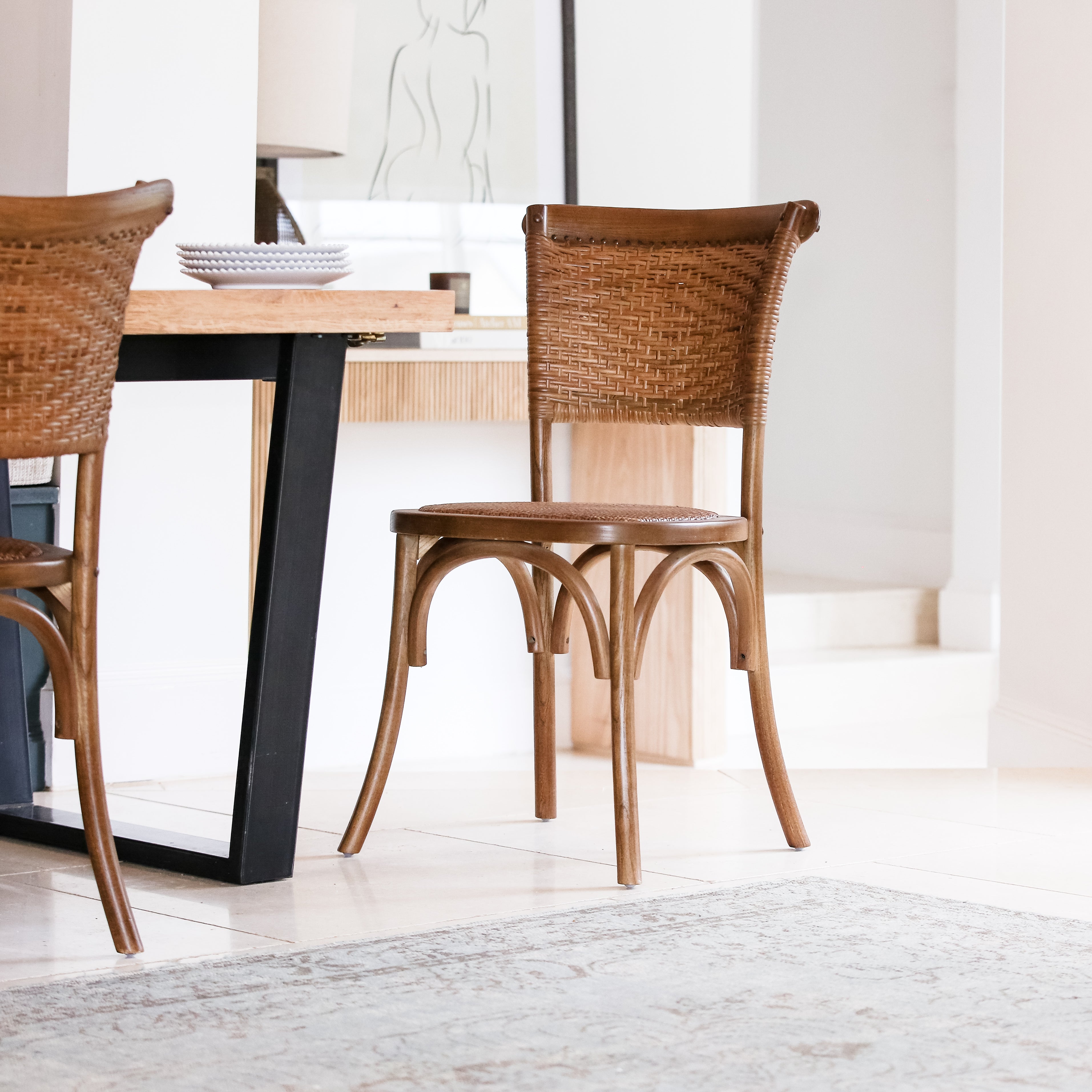 Full view of rustic elm and rattan dining chair