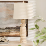 Indulge in the timeless charm of our travertine stone table lamp. Each piece is crafted with precision, creating a stunning balance between the pure white marble base and the soft, elegant linen shade. Add an air of sophistication to any room with this luxurious and exclusive lamp.