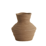 The Terra Forma Vase is a handcrafted ceramic piece inspired by the natural contours of wind-shaped desert landscapes. Its earthy brown finish and organic silhouette bring a grounded, rustic elegance to any space. Perfect for dried floral arrangements or as a standalone statement piece, this vase adds texture and warmth to minimalist and bohemian interiors alike. Each vase is uniquely shaped, embracing subtle imperfections that highlight its artisanal charm.