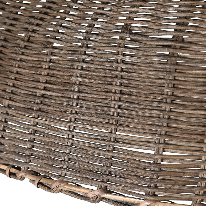Close-up view of woven rattan texture on dome-shaped pendant light