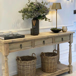 Three-drawer console table made from reclaimed, weathered pine