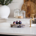 Three faux figs on a breadboard