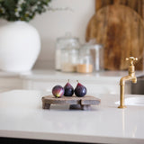 Three faux figs on a breadboard