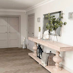 Large acacia wood console table supported by two balustrades