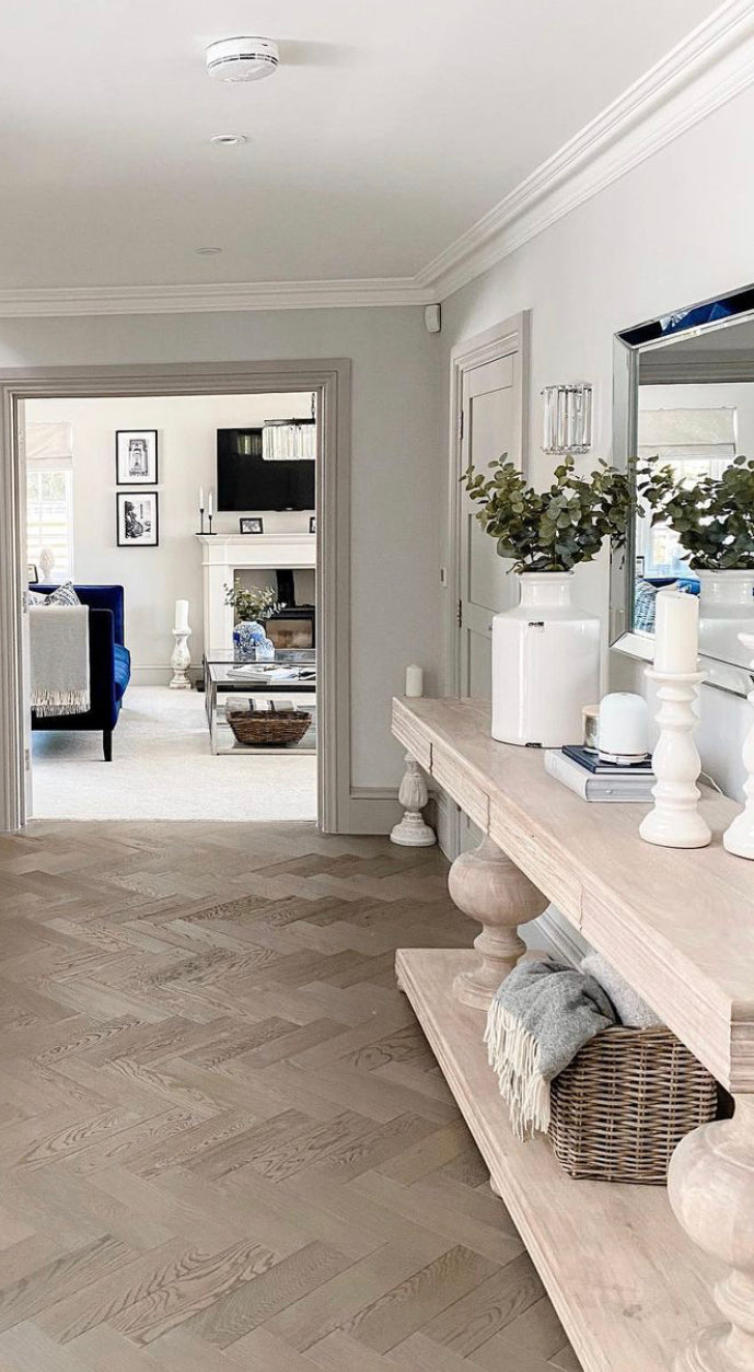 Large acacia wood console table supported by two balustrades