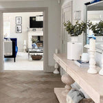 Large acacia wood console table supported by two balustrades