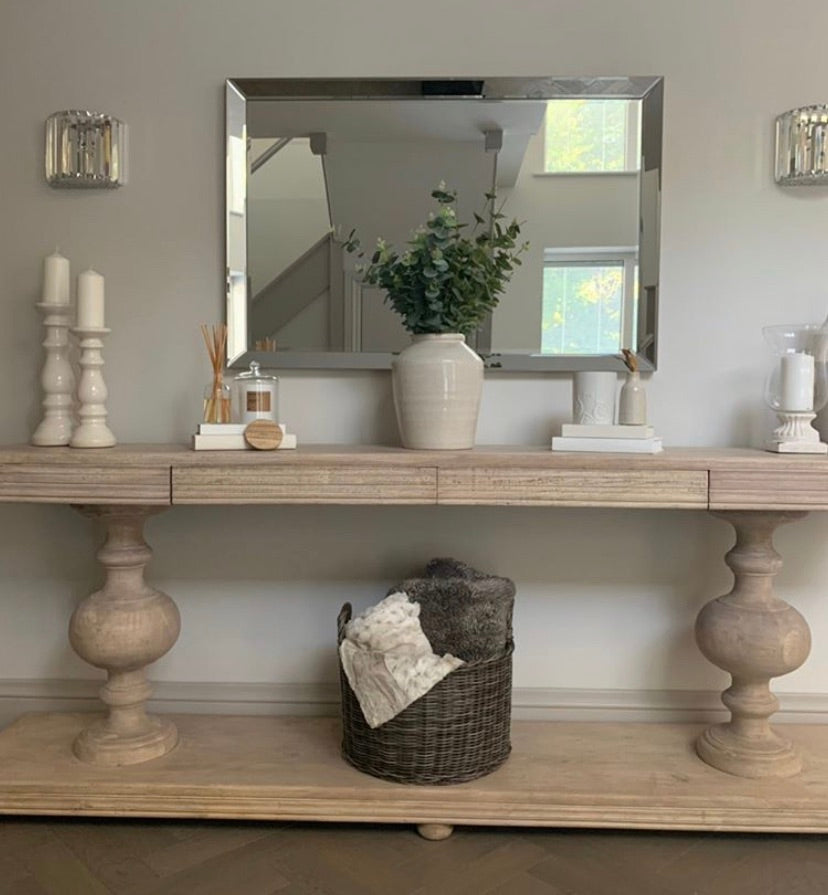 Large acacia wood console table supported by two balustrades