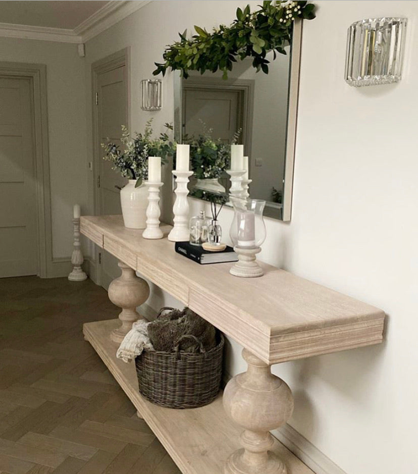 Large acacia wood console table supported by two balustrades