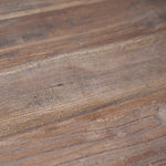 Close up of the reclaimed pine tabletop, showcasing the imperfections that add natural character