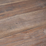 Close up of the reclaimed pine tabletop, showcasing the imperfections that add natural character