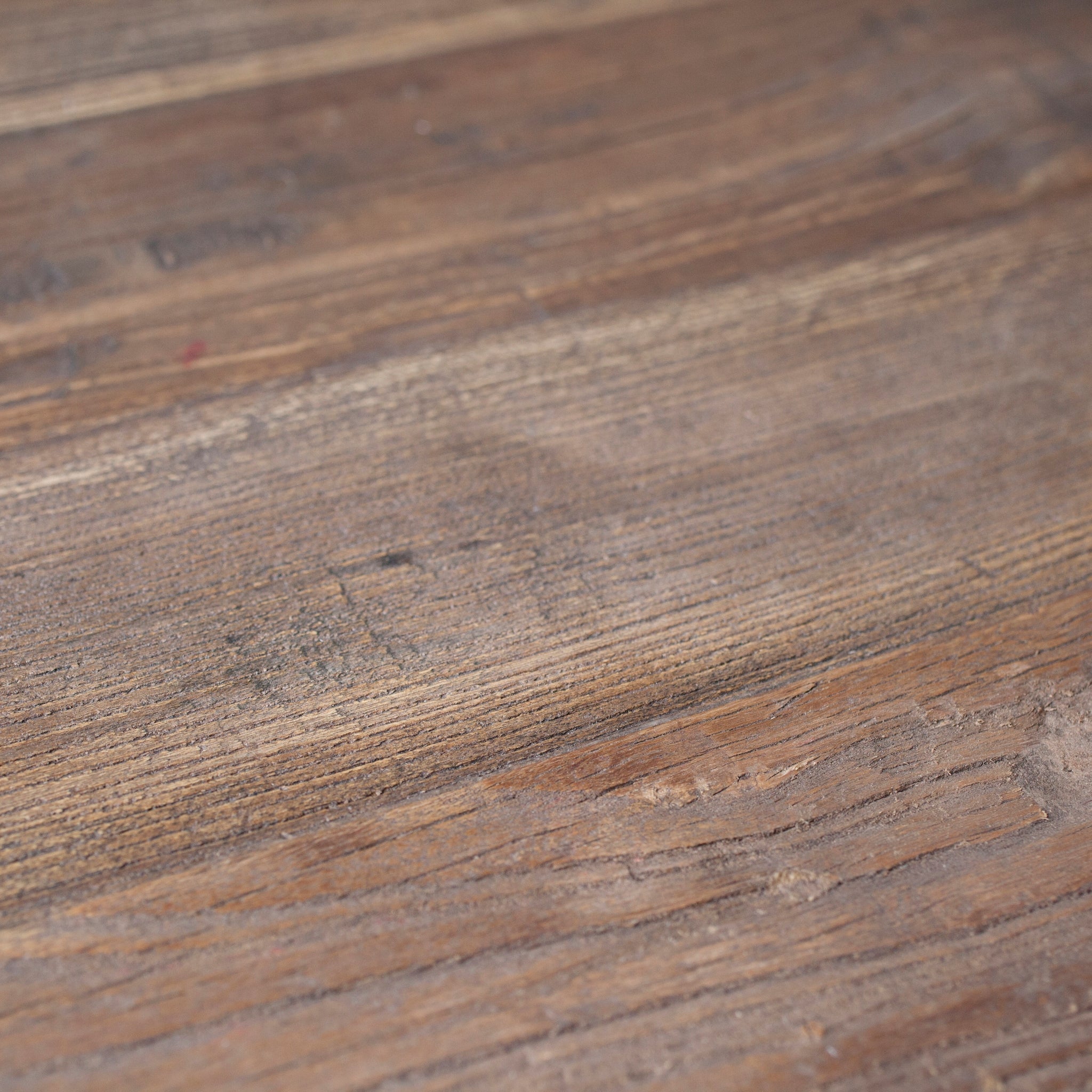 Close up of the reclaimed pine tabletop, showcasing the imperfections that add natural character