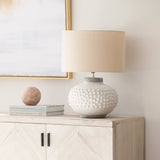 A fabulous statement crackle glazed ceramic lamp with bobble features with topped with a neutral shade.