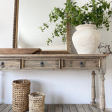 Three-drawer console table made from reclaimed, weathered pine
