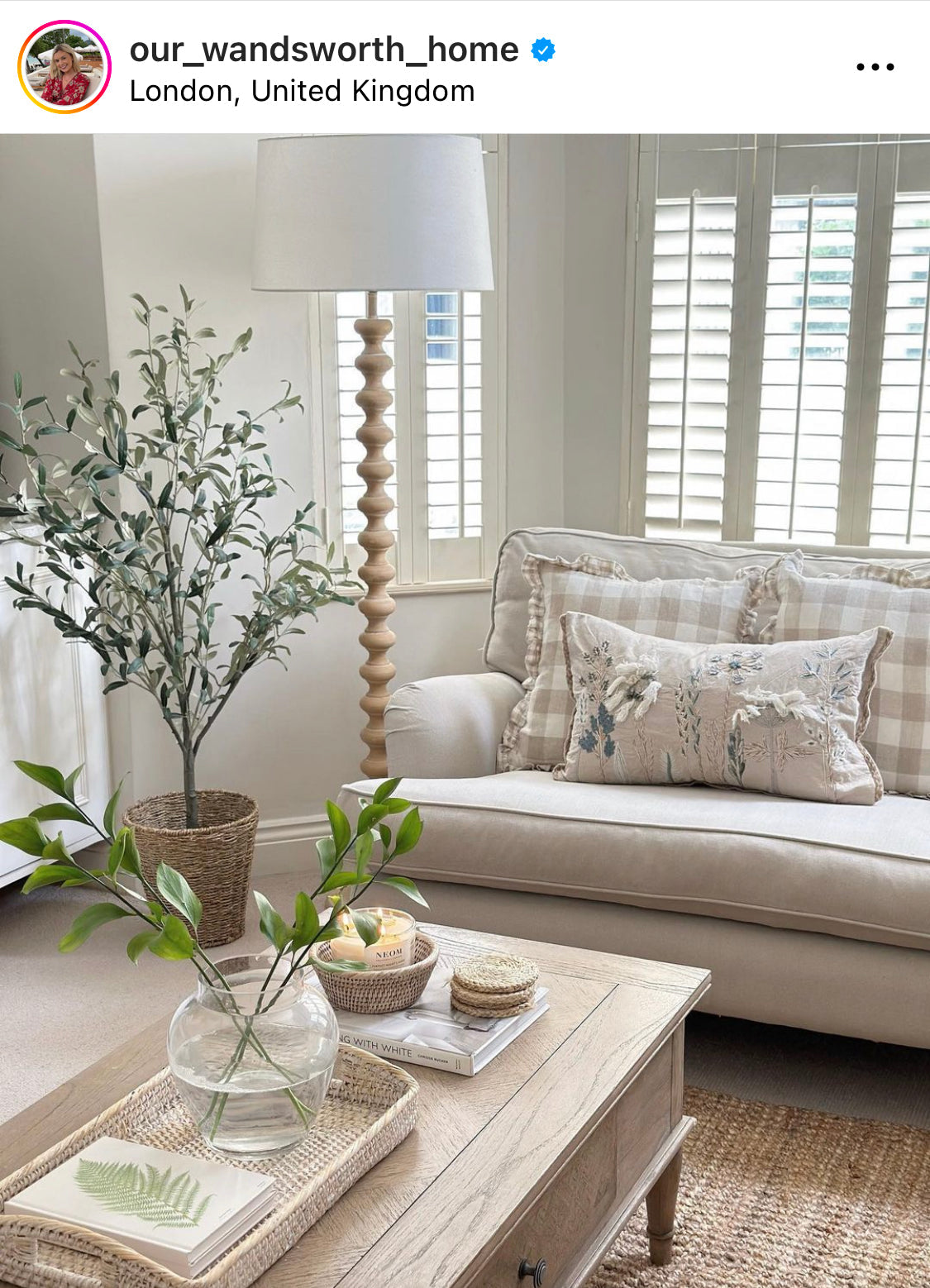 A stunning floor lamp in a beautiful turned pale wood complete with off white linen shade.